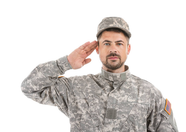 Saluting soldier on white background - 写真・画像