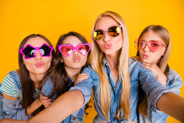 Close up photo portrait of four charming nice cheerful sweet dreamy lovely girls taking picture in modern denim outfit isolated vivid background - Foto, Imagem