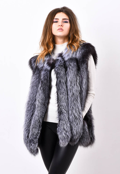 Woman makeup face wear fur vest white background. Silver fur vest fashion clothing. Luxury fur accessory clothes. Fashion trend concept. Winter fashionable wardrobe for female. Boutiques selling fur - Photo, Image