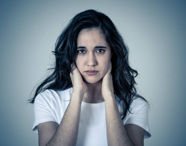 Portrait of young sad latin woman suffering depression looking thoughtful. Feeling emotional pain, sorrow distressed. Isolated with copy space. Human expressions Emotions and women Mental health. - Foto, Imagen