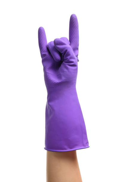 Mano femenina en guante mostrando "cuernos del diablo" gesto sobre fondo blanco
 - Foto, imagen