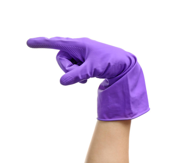 Female hand in glove pointing at something on white background - Foto, imagen