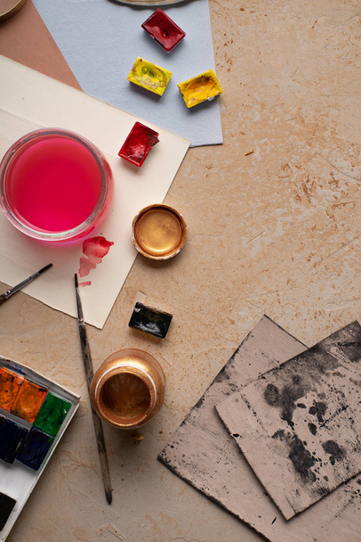 Artist workspace with art equipment on rustic background. Top view   - Photo, Image