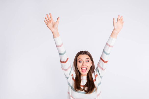 Ecstatic lady raising hands up yelling loud wear striped pullover isolated white background - 写真・画像