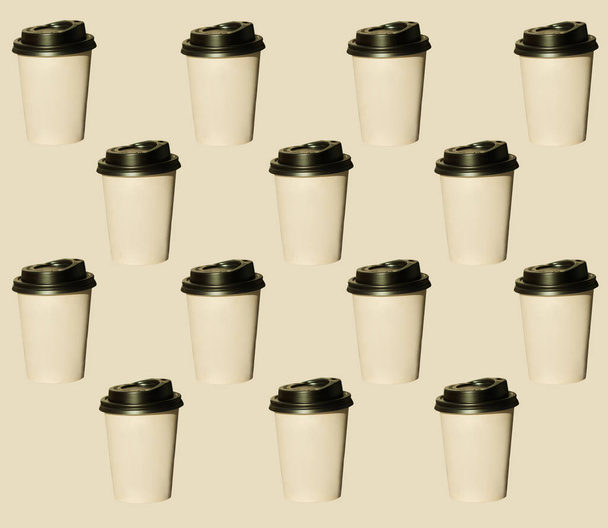 Coffee to go, regular pattern made of photography. Kraft paper cups with black lids. Lifestyle concept. - Photo, Image