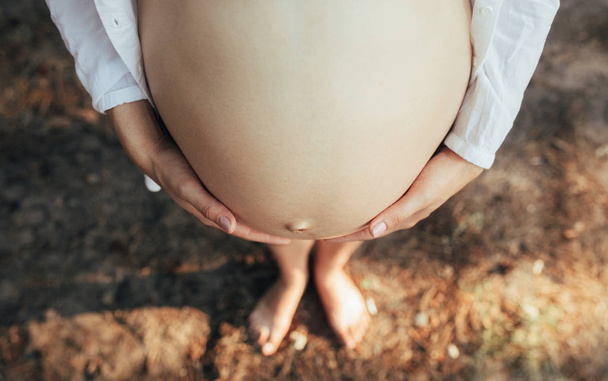 Belly standing pregnant woman closeup. - Фото, зображення