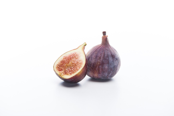 ripe whole and cut delicious figs on white background - Fotografie, Obrázek