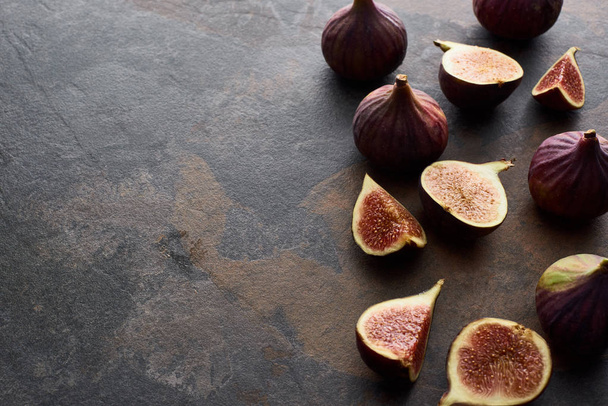 ripe whole and cut delicious figs on stone background - Photo, image