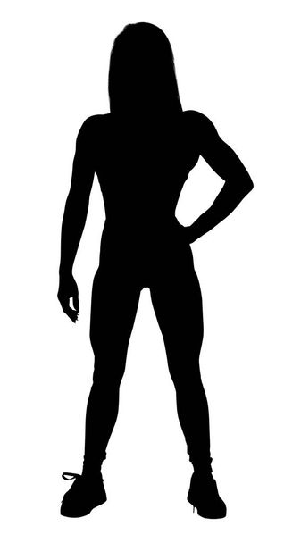 Μαύρη σιλουέτα της αθλητικής γυναίκας επέδειξε το μυϊκό της αθλητικό σώμα. - Φωτογραφία, εικόνα