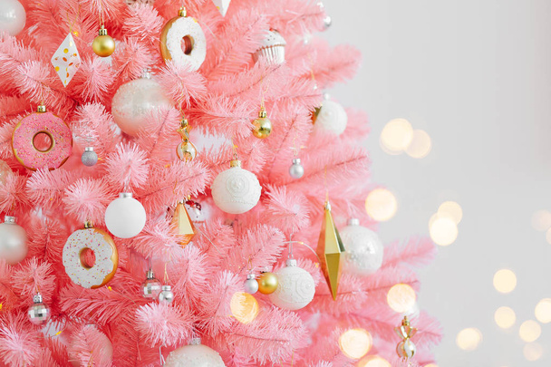 Pink Christmas tree and christmas decorations white and gold color.  Christmas background. Happy New Year and Xmas Christmas concept. - Foto, Imagen