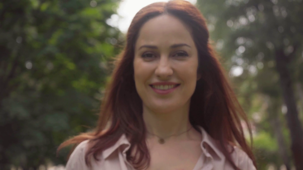 happy beautiful woman in green park - Video, Çekim