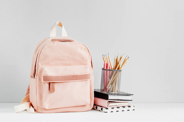 Backpack with school supplies and books for study. Back to school concept. Flat lay, top view  - Foto, afbeelding