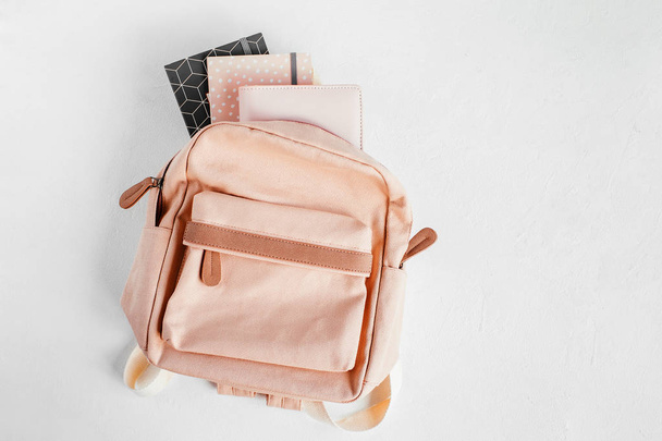 Backpack with school supplies and books for study. Back to school concept. Flat lay, top view  - Foto, immagini