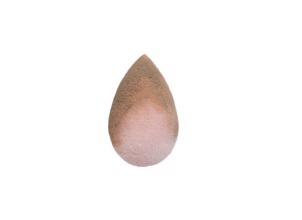 Pink beauty tear-shaped blender, dirty egg-shaped sponge isolated on white background. Cosmetic tool for makeup. - Photo, Image