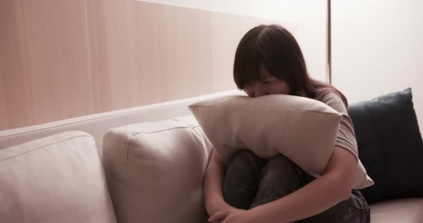 woman feel depressed on sofa - Filmati, video