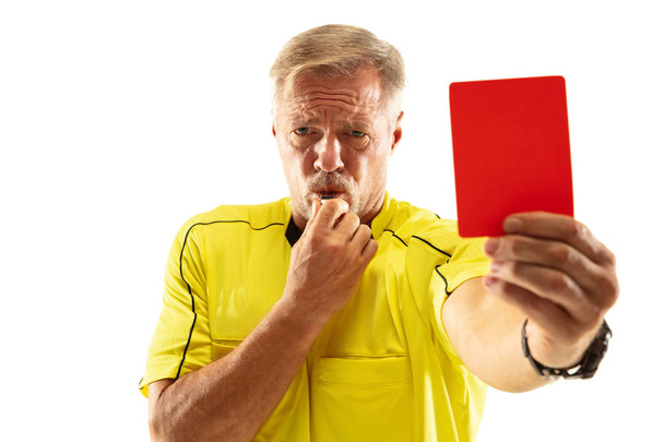 Football referee showing a red card to a displeased player isolated on white background - Foto, Imagen