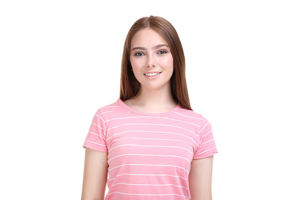 Young woman in pink t-shirt on white background - Fotó, kép