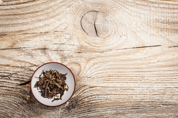 Black tea on old wooden table - Φωτογραφία, εικόνα