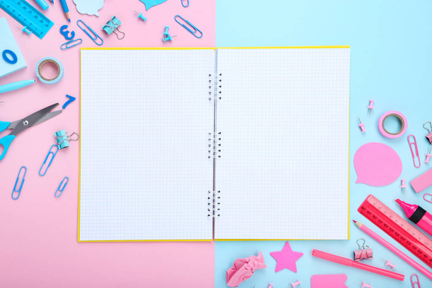 School supplies with blank sheet of paper on colorful background - Photo, image