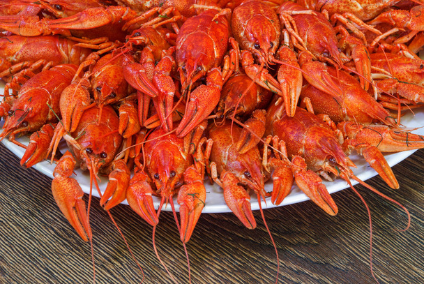 Still life with crayfish crawfish on old wooden background - Foto, imagen