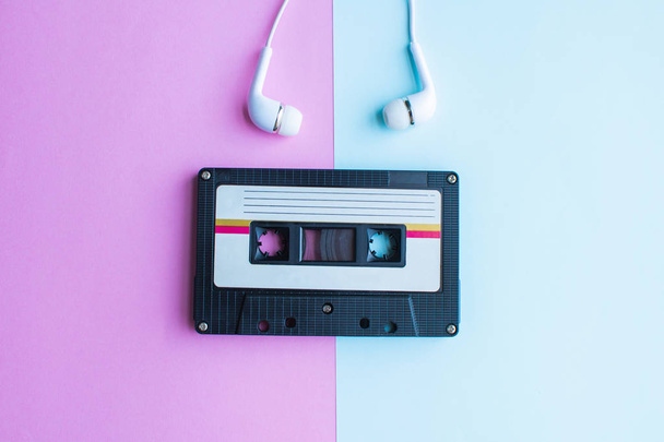 retro of tape cassette on blue and pink background. soft focus. - Photo, Image