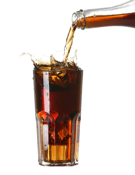 Pouring of cold cola into glass on white background - Photo, Image