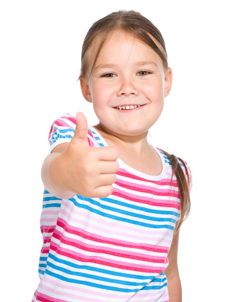 Kislány van bemutatás megjelöl gesztus hüvelykujj - Fotó, kép