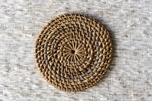 Decorative wicker stand on the table, closeup, top view - Foto, afbeelding