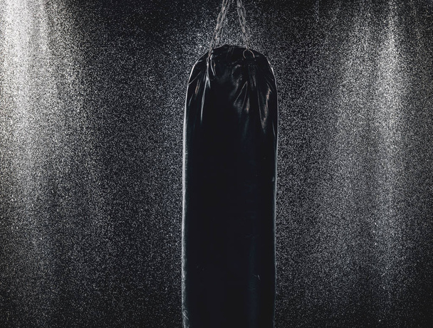 Punching bag and dark wet walls - Photo, Image
