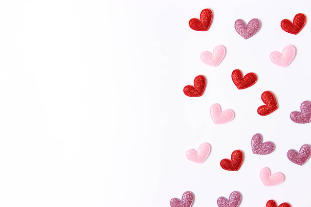 Hearts on a white background top view. Holiday background for Valentine's Day. - 写真・画像