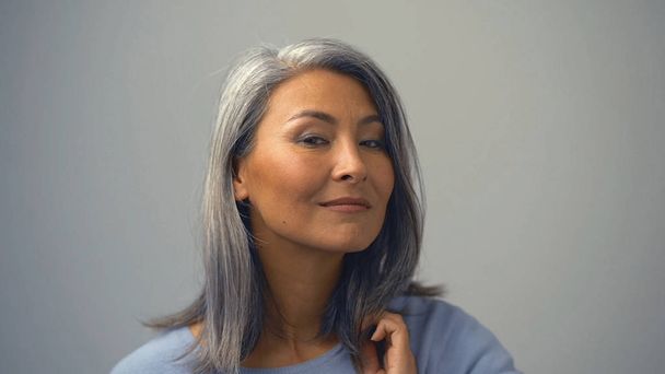 Grey-Haired Asian Woman With A Mysterious Expression On her Face - Foto, Imagem