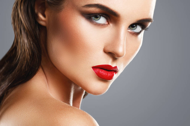Portrait of beautiful young woman with a red lipstick  - Zdjęcie, obraz