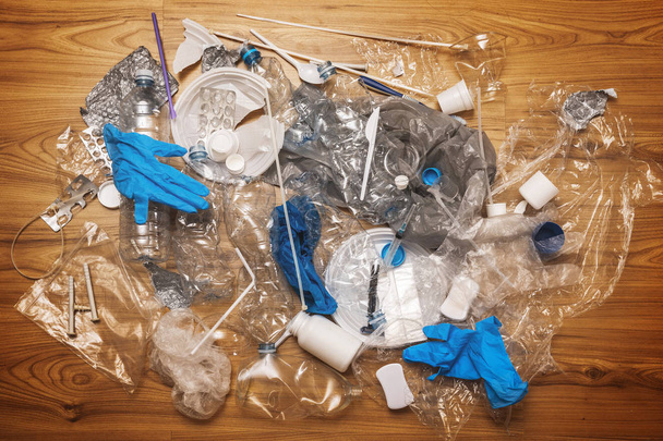 Pile of different plastic waste on wooden surface - Φωτογραφία, εικόνα