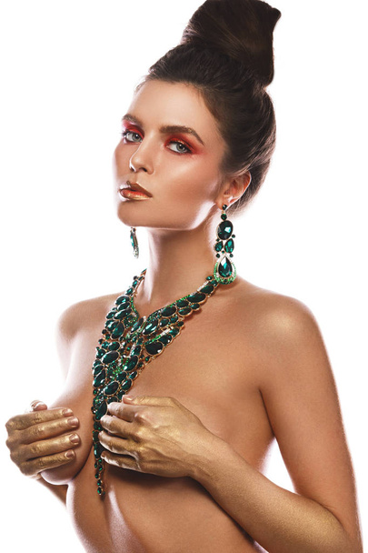 Sexy woman wearing big beautiful necklace with a lot of gems - Foto, immagini