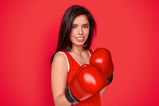 Smiling female boxer in gloves - Photo, Image