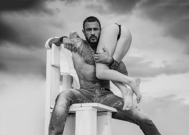 Male perfume for really man. Crazy sex. Beautiful lady and latinos man in erotic pose on sky background. - Foto, Bild