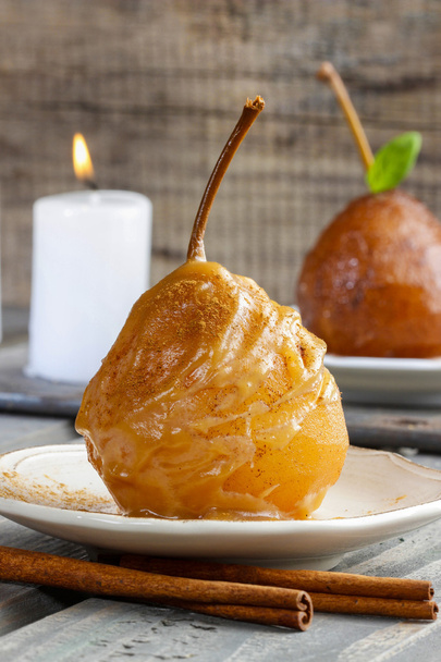 Pear with caramel sauce. French dessert - Zdjęcie, obraz