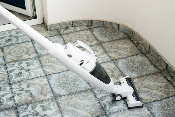 house cleaning with a vacuum cleaner, cleanliness in the apartment - Photo, Image