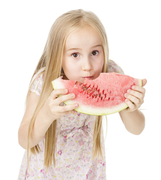Tyttö mekko syö vesimelonia
 - Valokuva, kuva