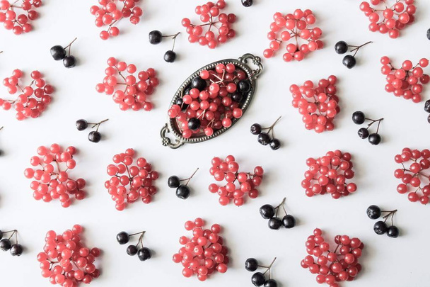 Pattern from fresh red and black berries isolated on white background. - Фото, изображение