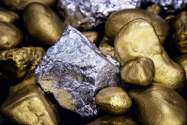 Gold and silver nuggets on black background. Precious stones, luxury concept and mineral drainage. Industrial activity, treasure and fortune. - Photo, image