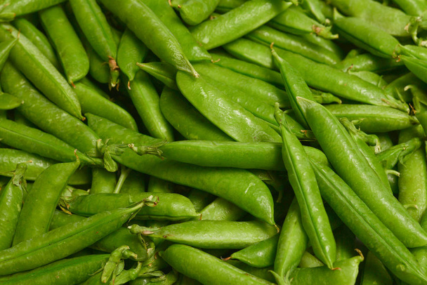 Fresh pea pods as background. Top view. - Фото, изображение