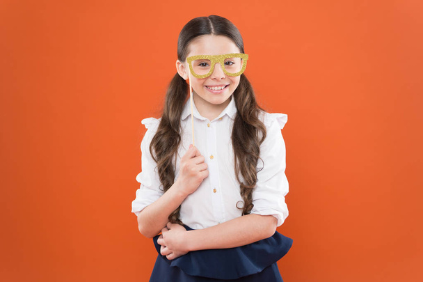 she is ready. school girl in uniform. child with party glasses. smart and intelligent kid on orange background. back to school. funny study. knowledge day. happy childhood. small girl student - Foto, immagini