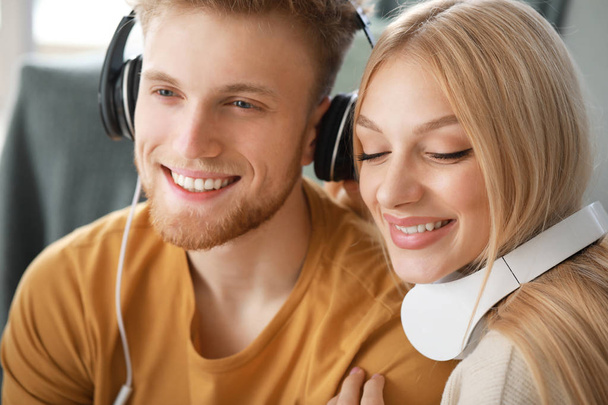 Young couple listening to music at home - Photo, image