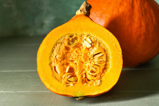 Fresh pumpkin on color background - Foto, afbeelding
