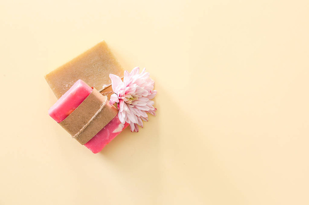 Soap bars and flower on color background - Photo, Image