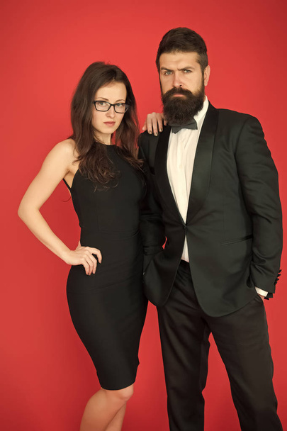 He will melt your heart. Bearded man and woman dating. couple in love on date. Formal couple of man in tuxedo and sexy woman. romantic date. formal fashion look. Proposal or engagement party. Romance - Fotó, kép