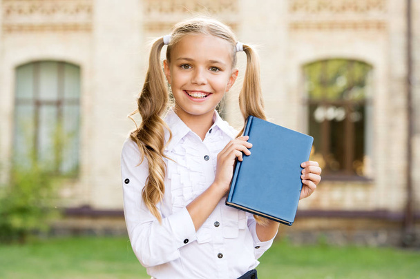 Ready for lessons. Secondary school student. Cute smiling small child hold book. Adorable little girl school student. Study language. School education concept. Cute little bookworm. Knowledge day - Photo, Image