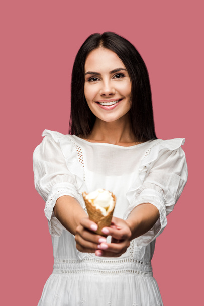 selective focus of happy woman holding tasty ice cream cone isolated on pink  - Фото, изображение
