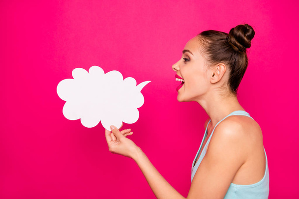 Profile side view photo of lovely person holding paper card bubble cloud shouting isolated over fuchsia background - Foto, Imagem